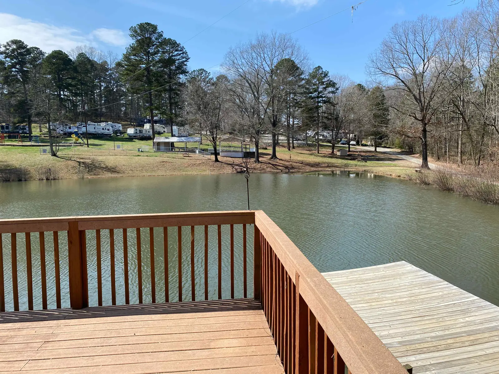 Wooden fishing deck overlooking the pond at Cobble Hill