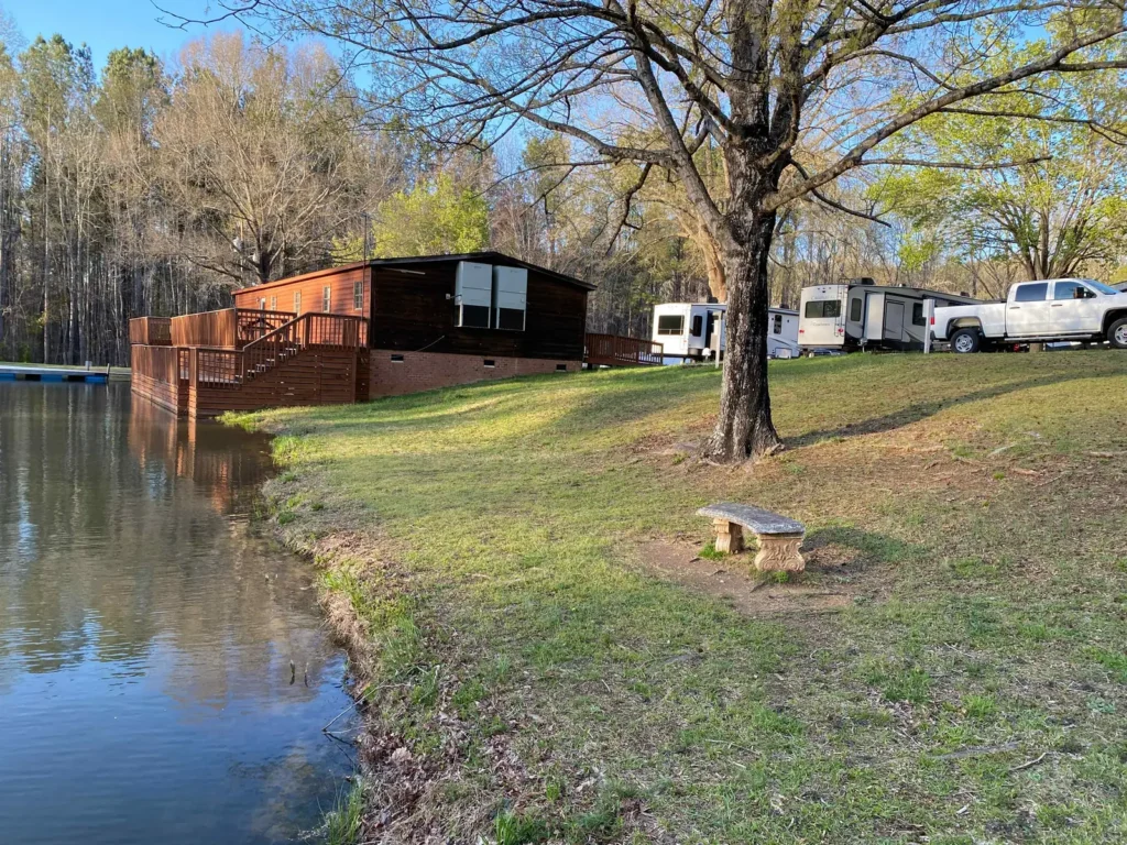 Pond with cabins and RV sites along the shore at Cobble Hill