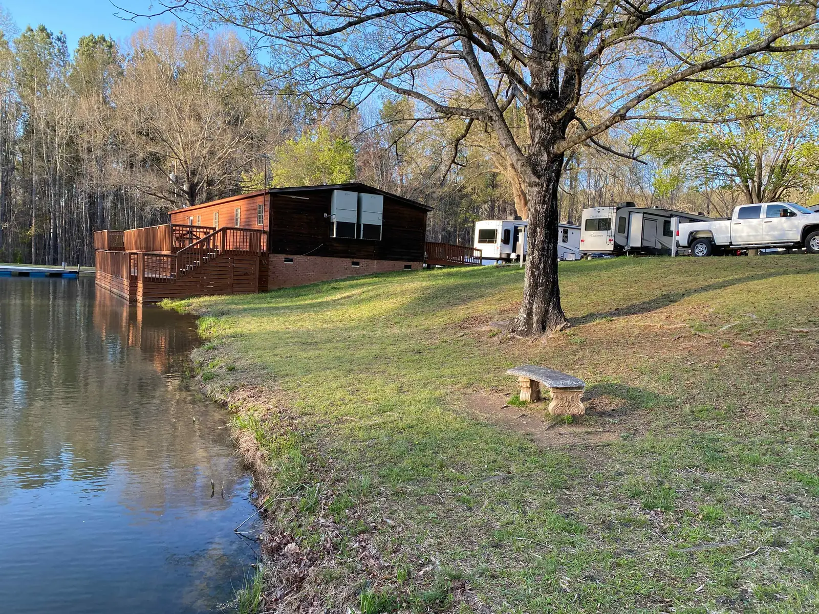 Pond with cabins and RV sites along the shore at Cobble Hill