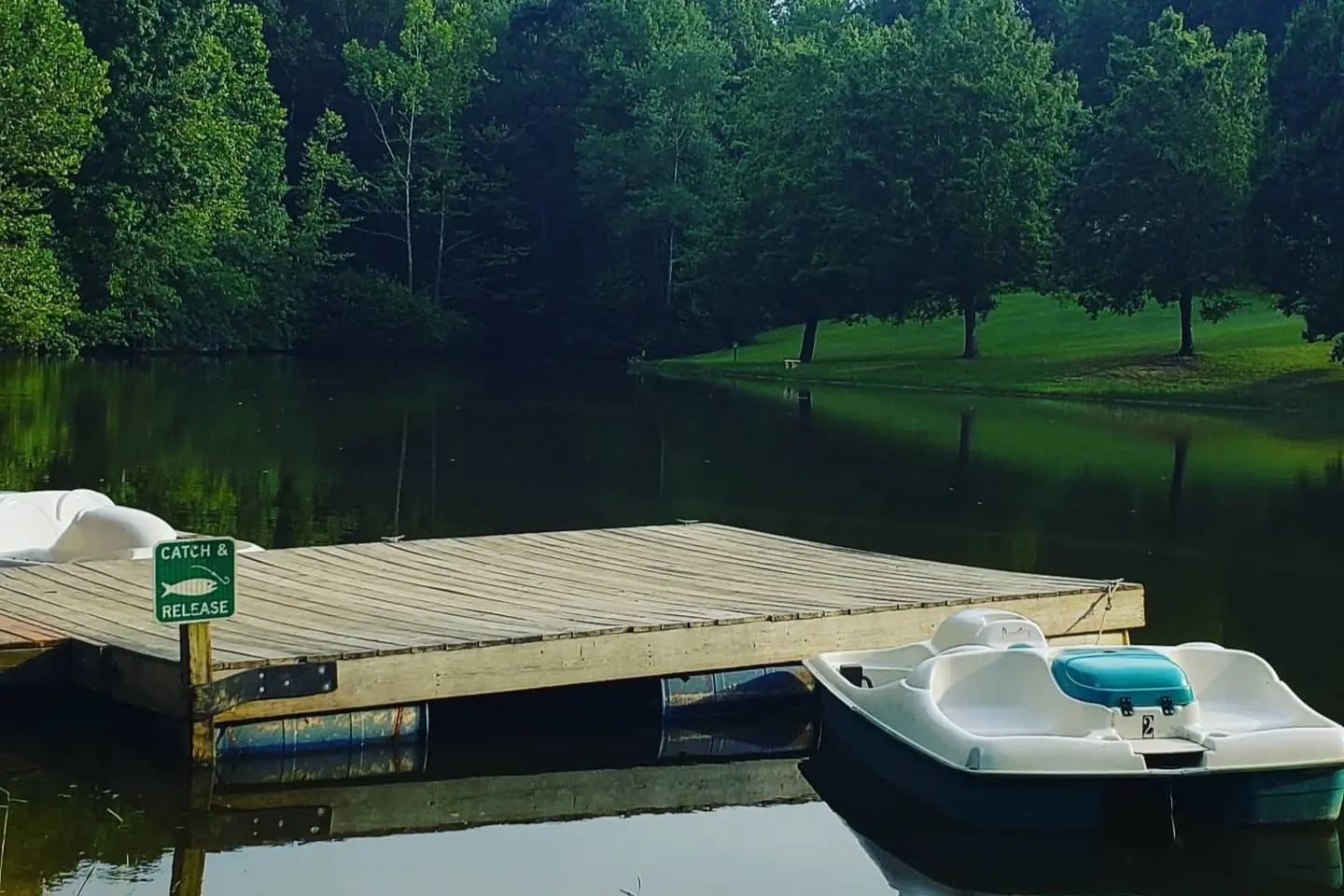 Fishing dock and paddle boats on the private pond at Cobble Hill